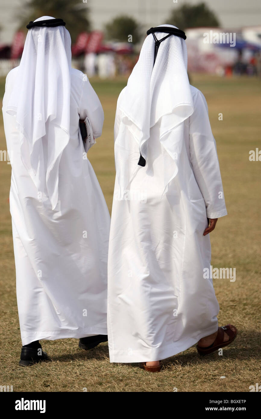 Two Arabs in traditional clothing, Dubai, United Arab Emirates Stock Photo