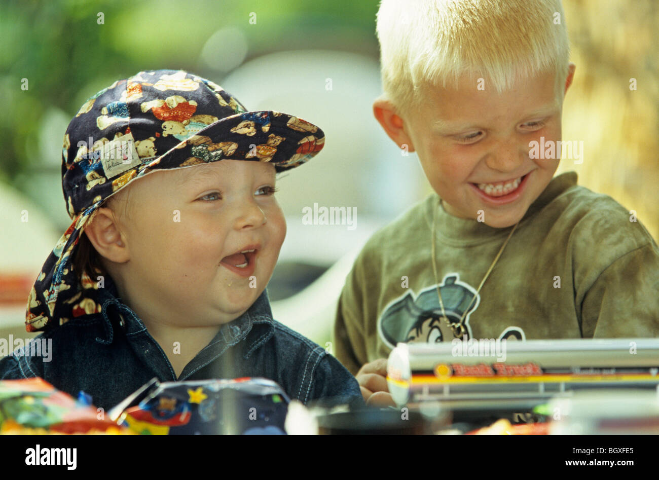 two small boys playing with their toy cars Stock Photo - Alamy