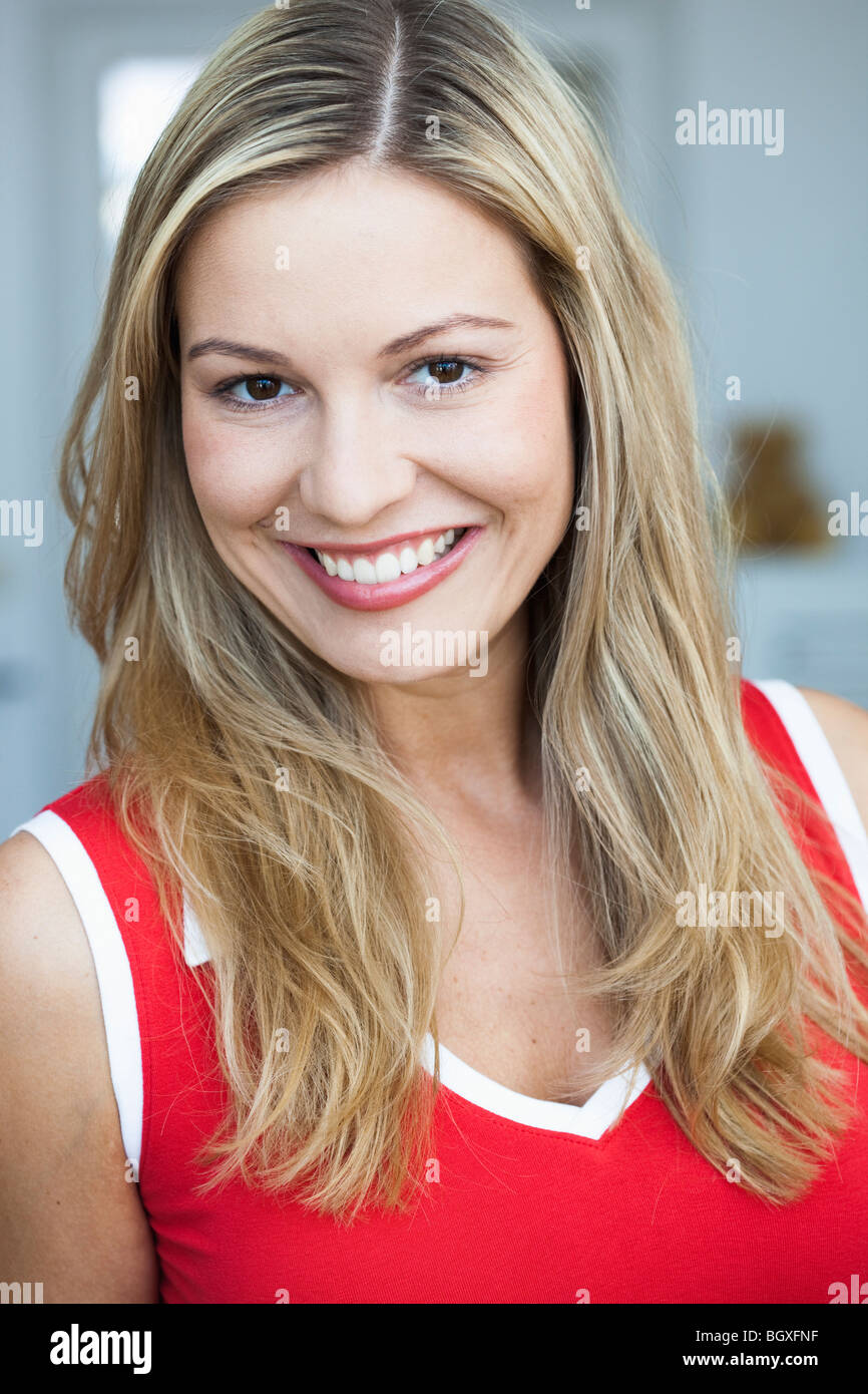 Glad young female smiling hi-res stock photography and images - Alamy
