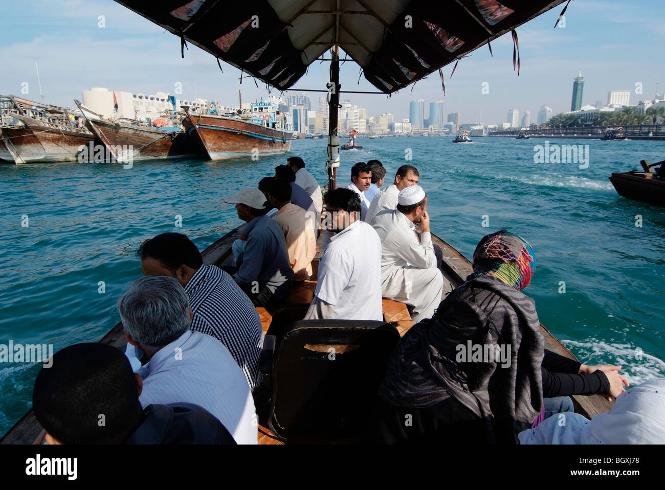 An abra ferries passengers across the creek in Dubai, UAE. Stock Photo