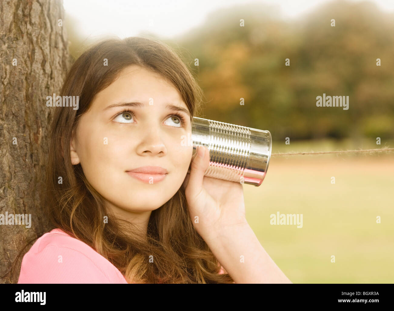 Girl Listening to Tin Can Phone Stock Photo Alamy