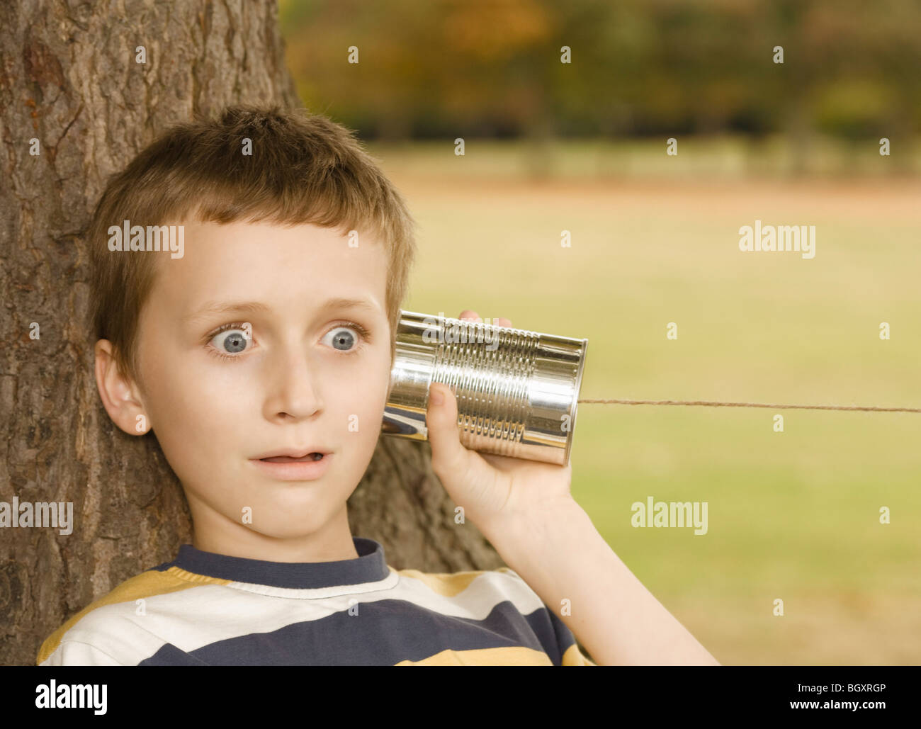 Boy Listening to Tin Can Phone Stock Photo Alamy