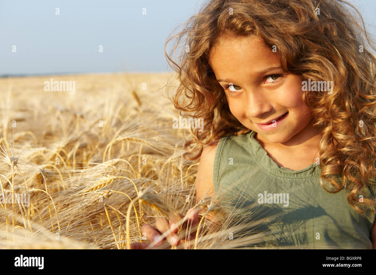 Girl in a wheat field Stock Photo - Alamy