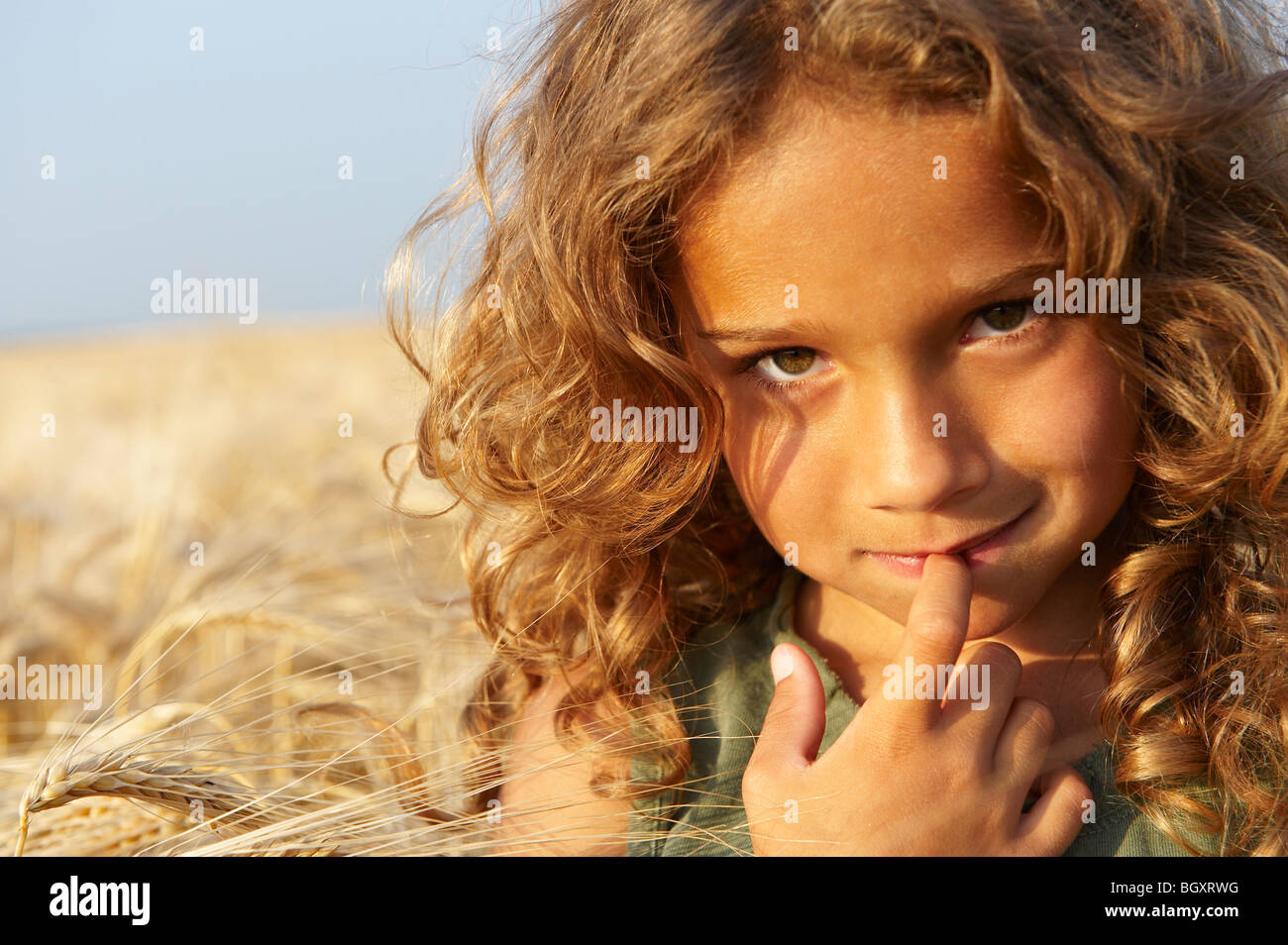 Girl in a wheat field Stock Photo - Alamy