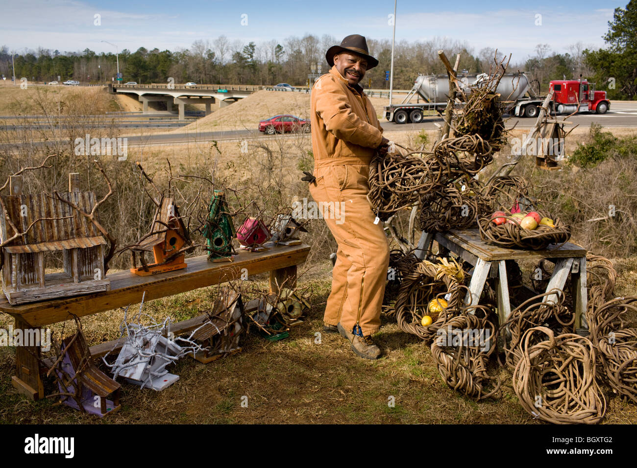 Man selling hand made kudzu baskets and bird houses in Fort Deposit, Alabama Stock Photo