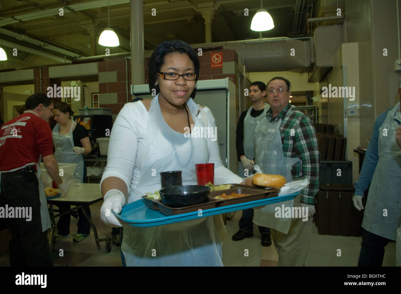 Volunteers serve Sunday lunch at the St. Francis Xavier Mission's