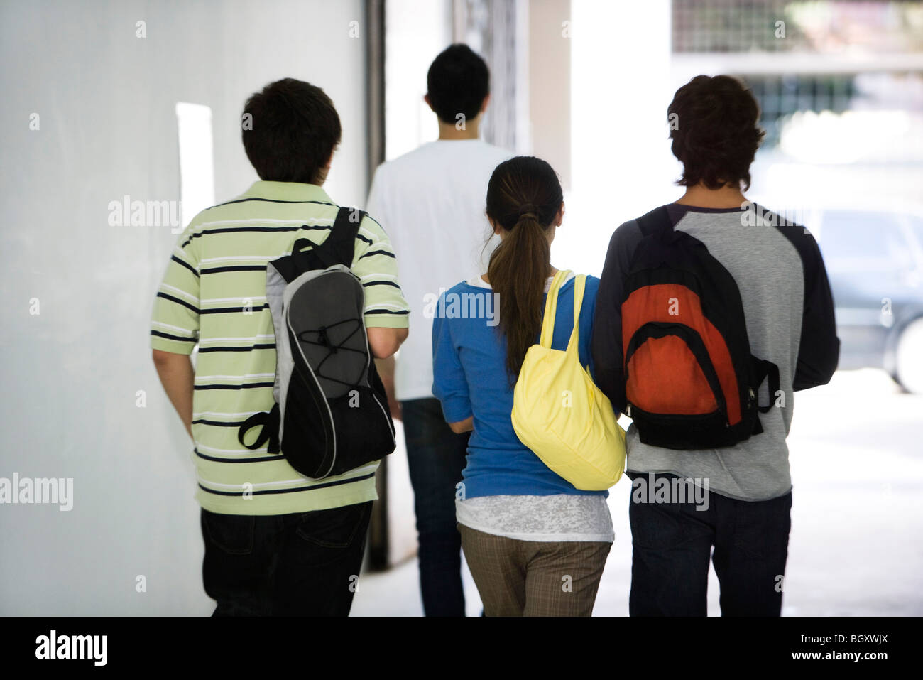 Students walking together in corridor, rear view Stock Photo