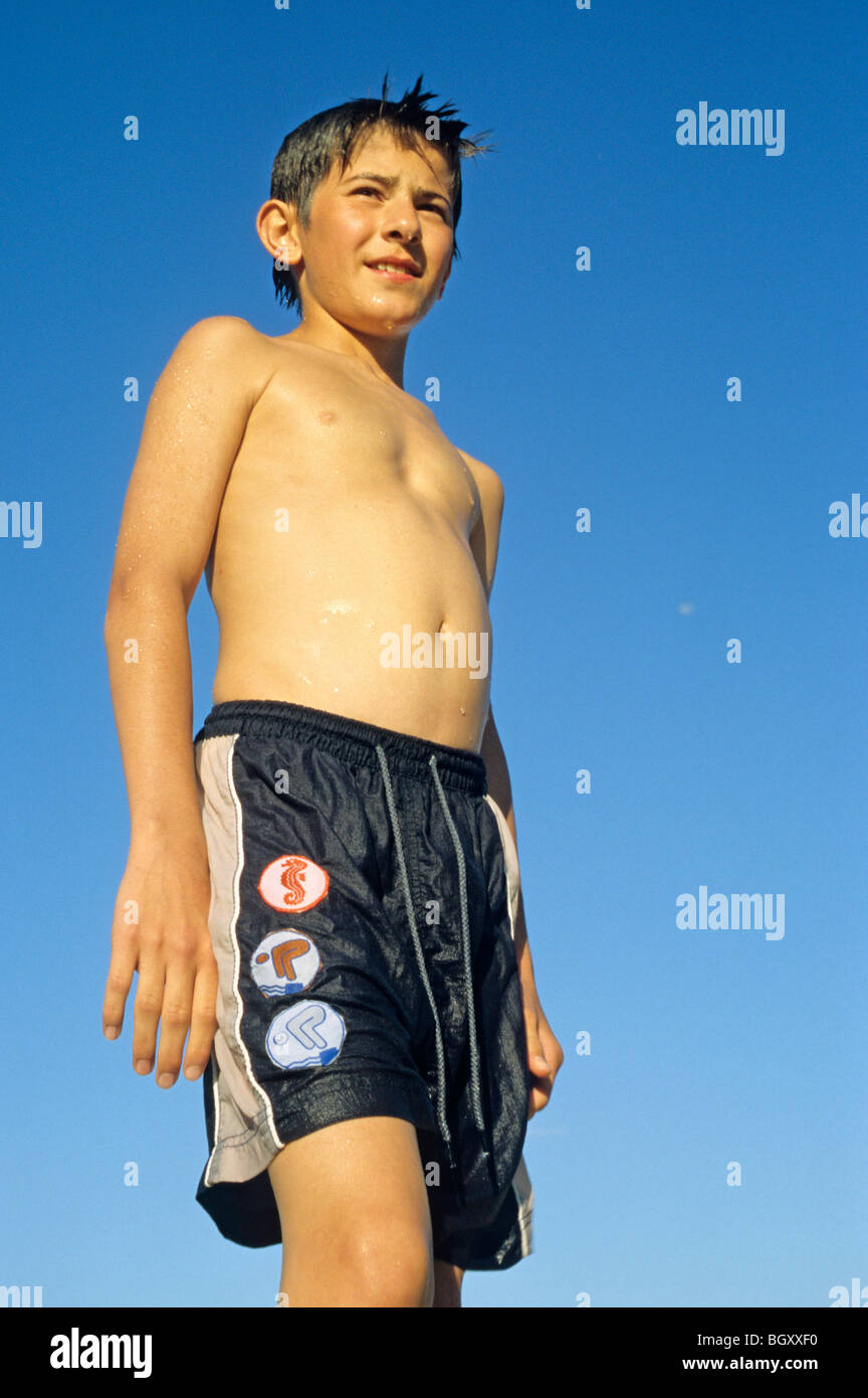 portrait of a young boy proudly showing his swimming patches Stock ...