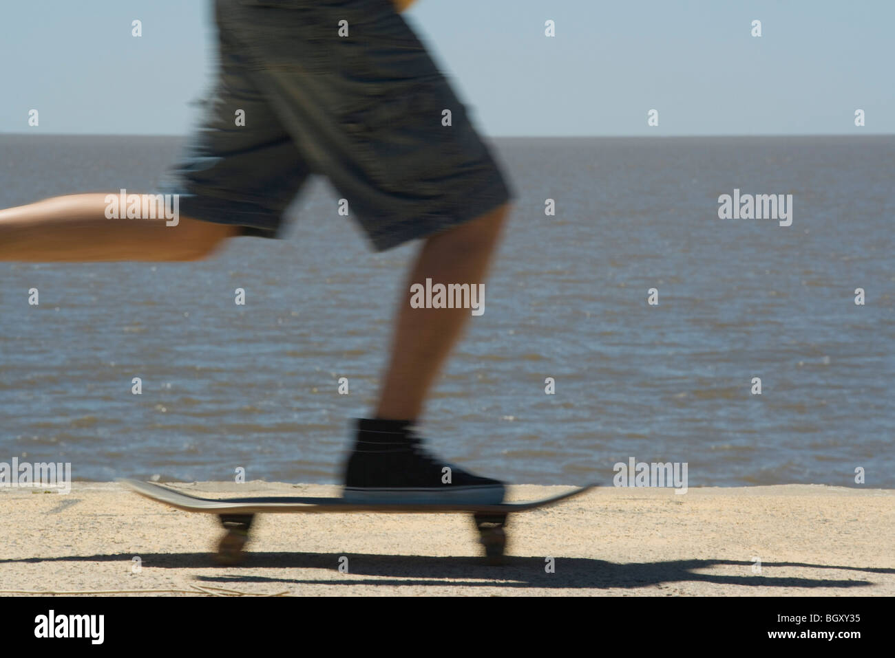 Skateboarding at seaside park Stock Photo