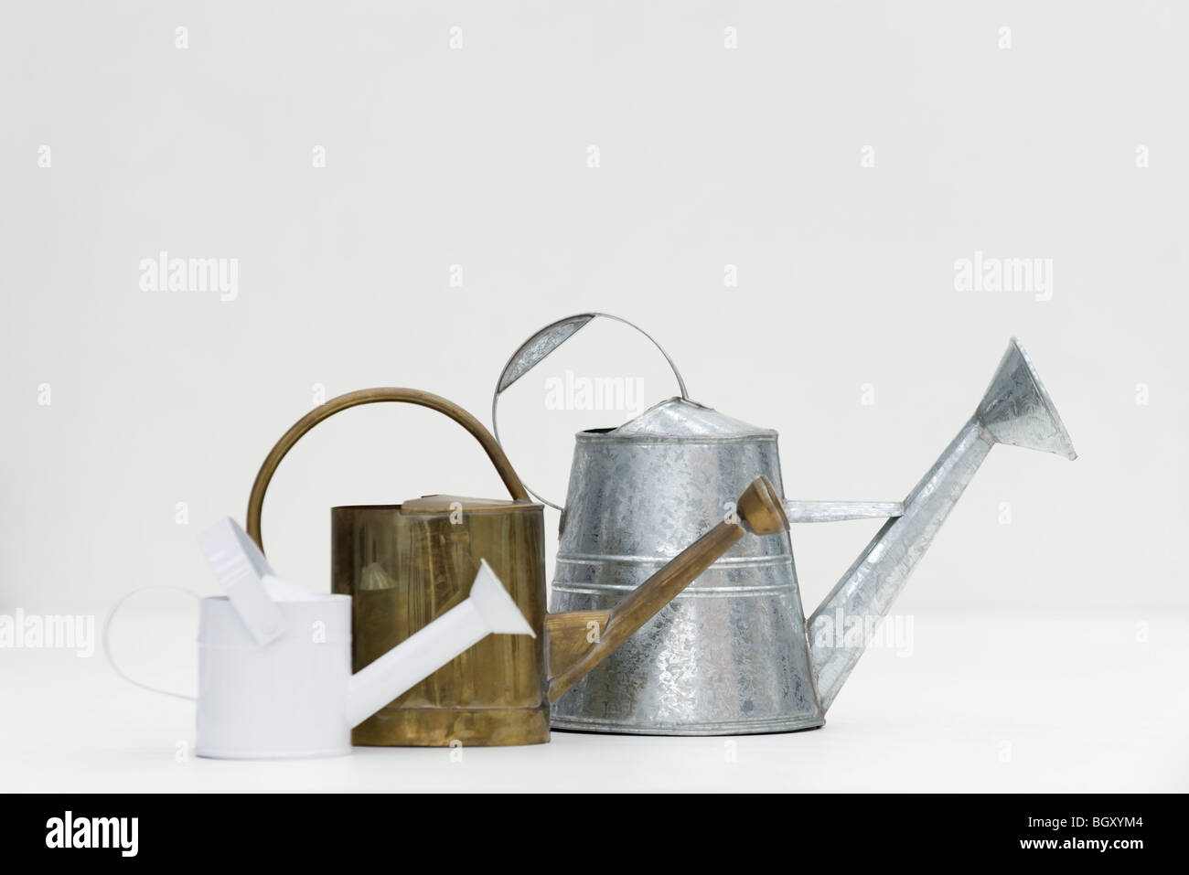 Watering cans of various sizes Stock Photo Alamy