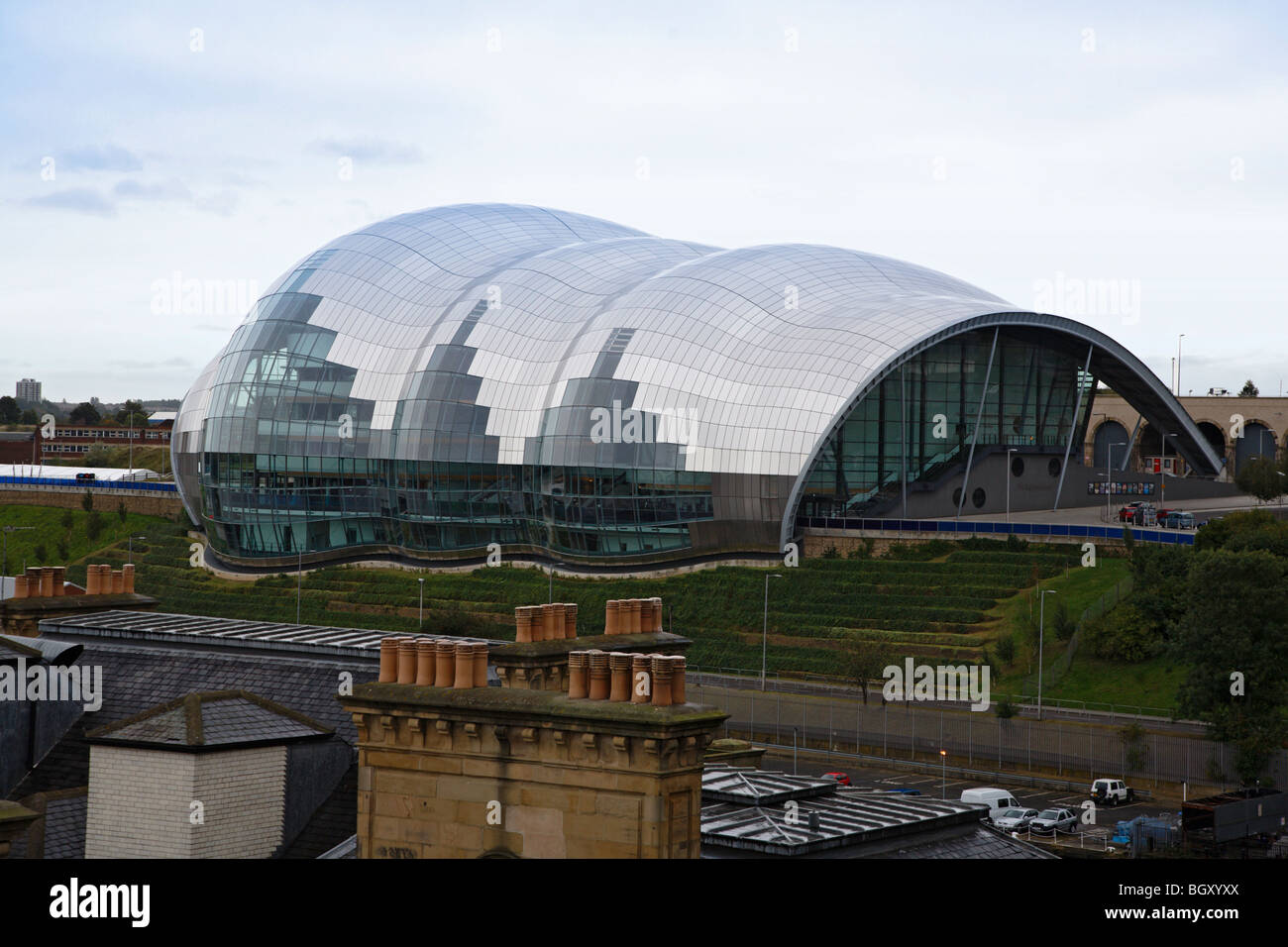 The Sage Gateshead with the chimneys of older properties in the foreground Stock Photo