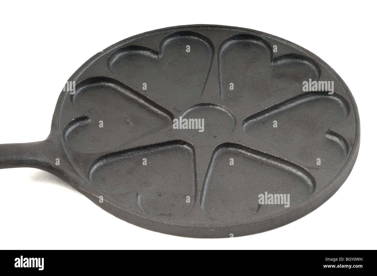Castiron heavy pan with heart shapes Stock Photo Alamy