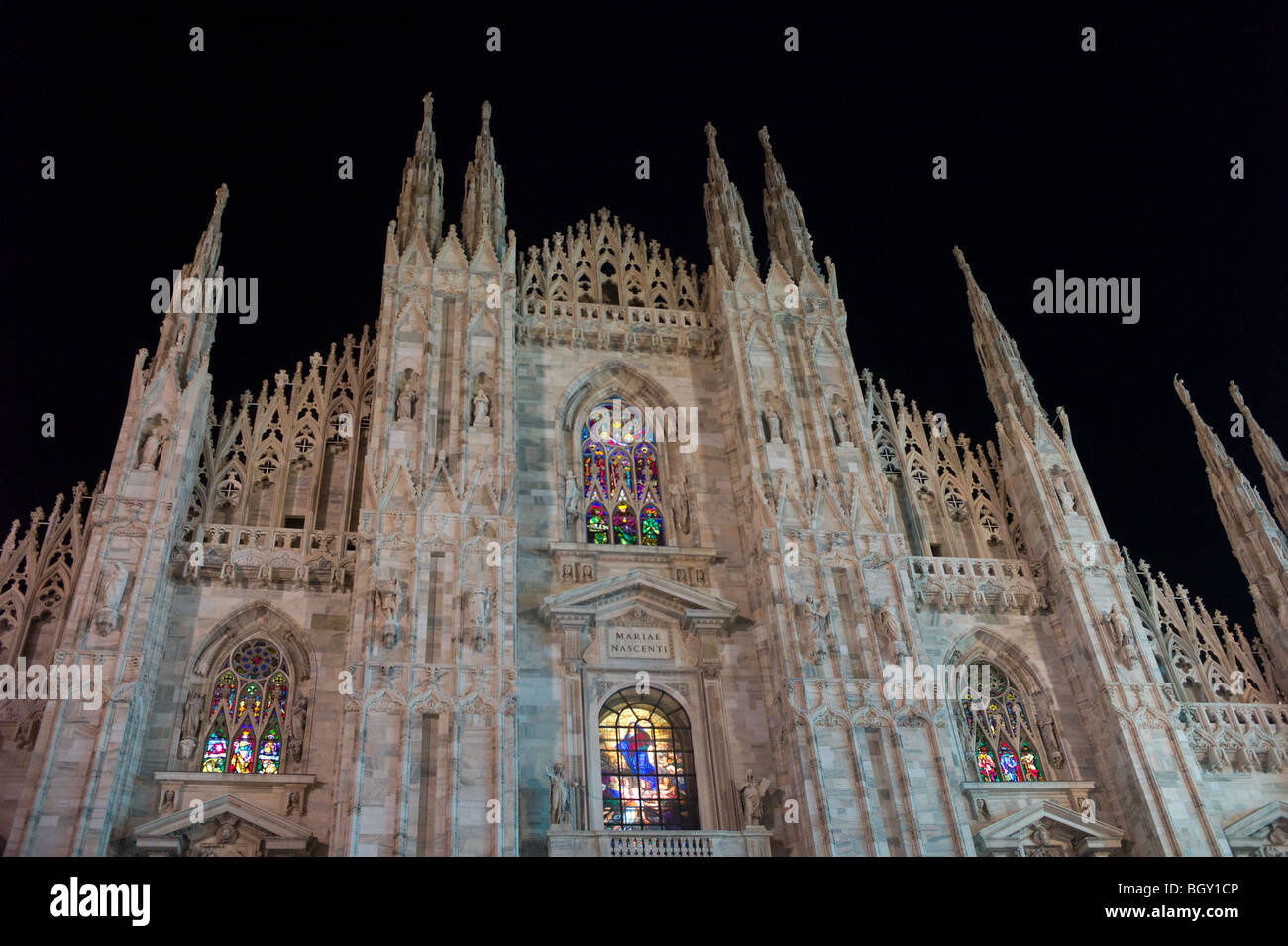 Duomo, Milan, Italy at night, with stained glass windows backlit for Christmas Stock Photo