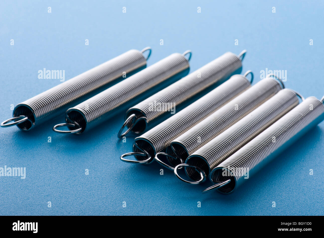 object on blue - tool metal spring Stock Photo