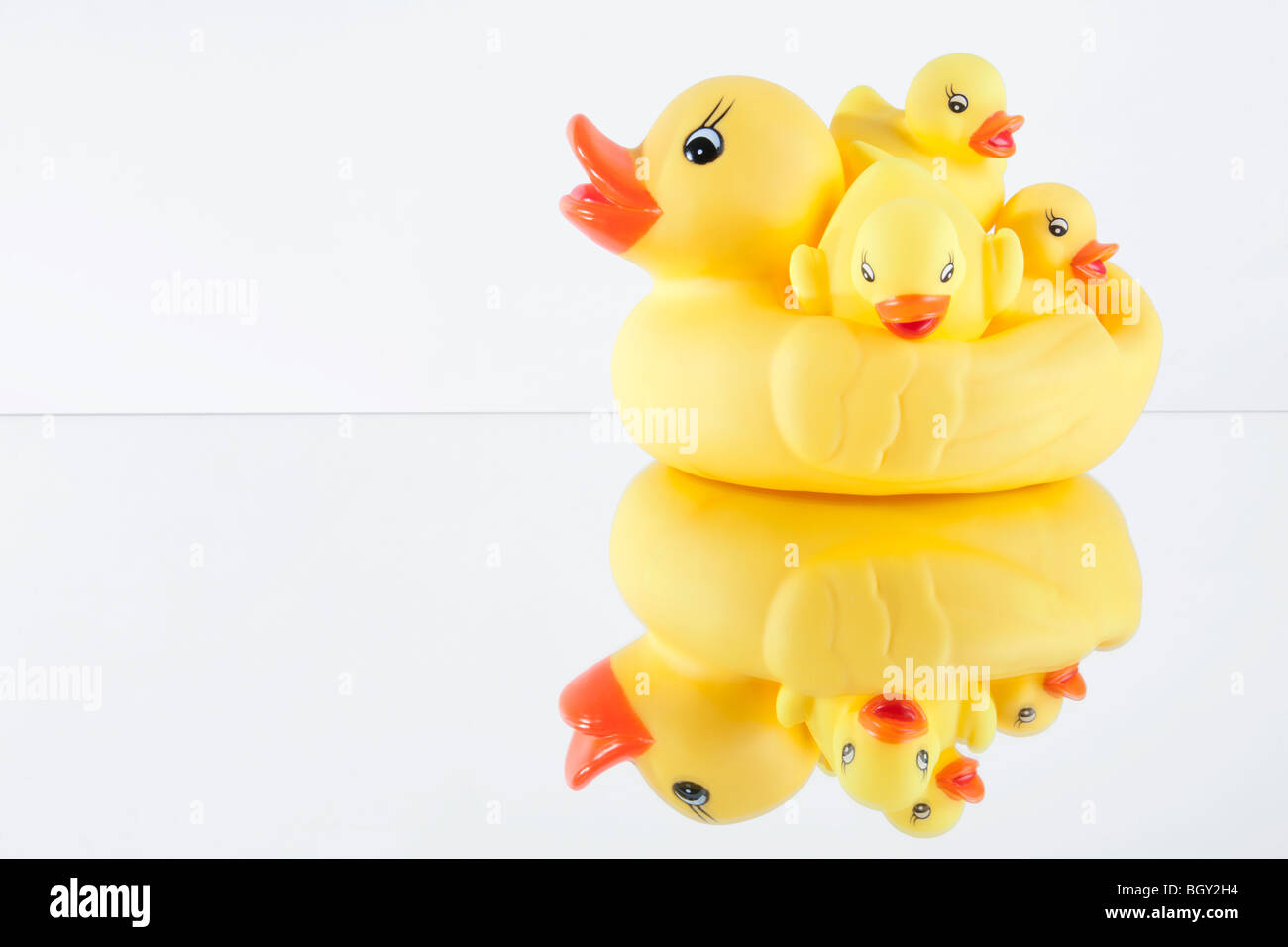Family of yellow rubber ducks grouped together hi-res stock photography ...