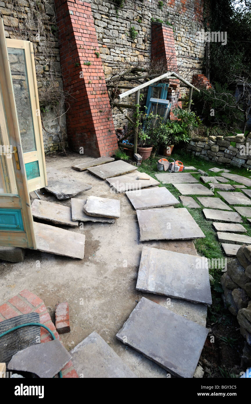 Natural stone slabs laid out in the planning of a patio
