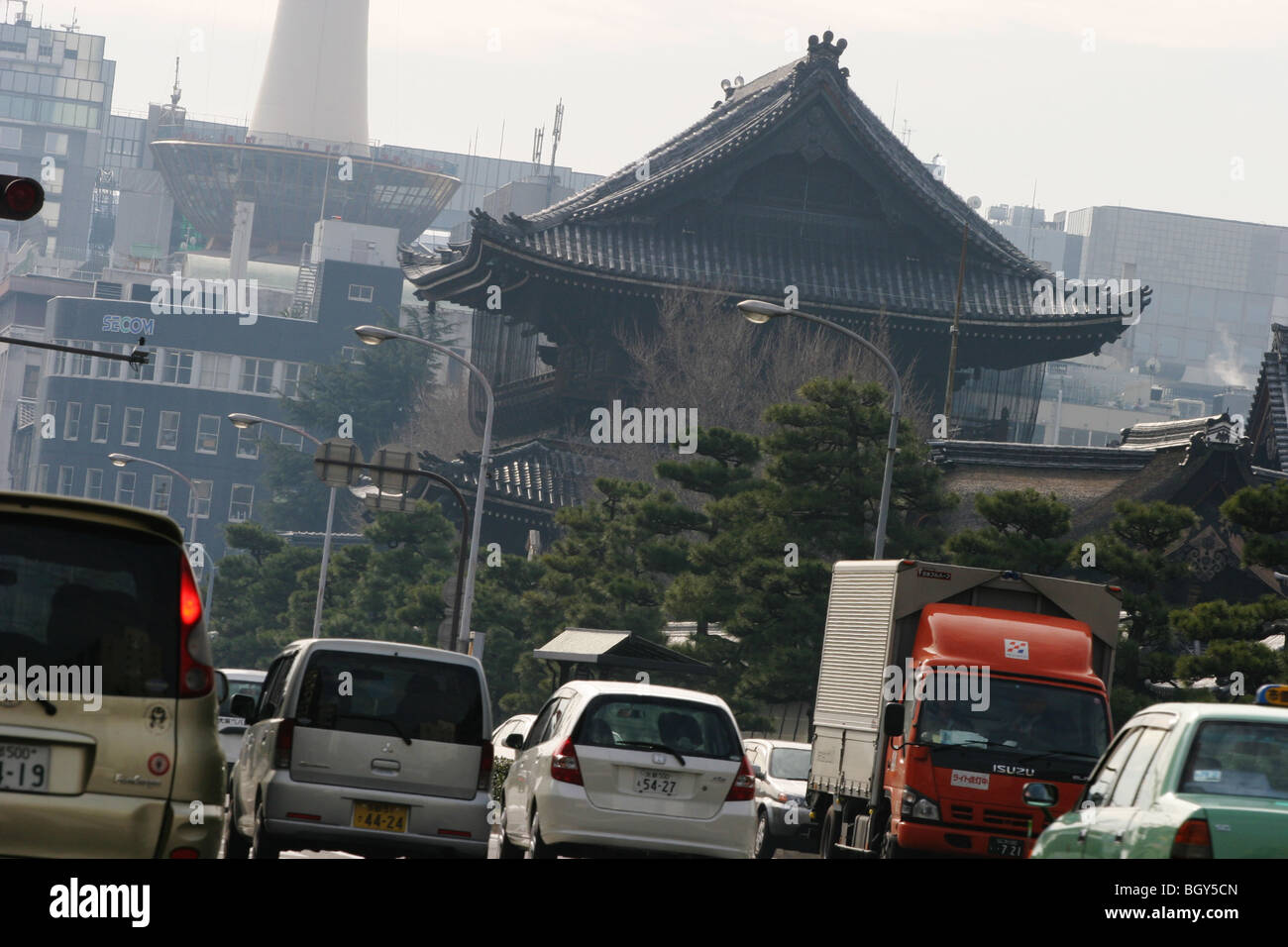 Traffic passes by Higashi-Honganji Temple in downtown Kyoto, Japan, on Tuesday, Jan. 16, 2007. Stock Photo