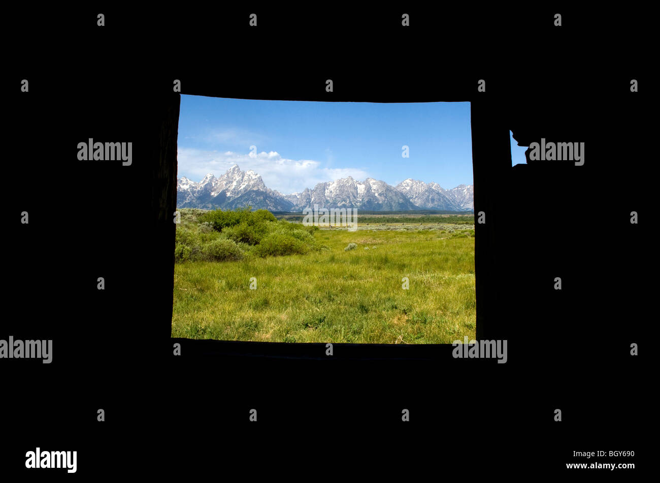 View of the Grand Tetons from window Stock Photo