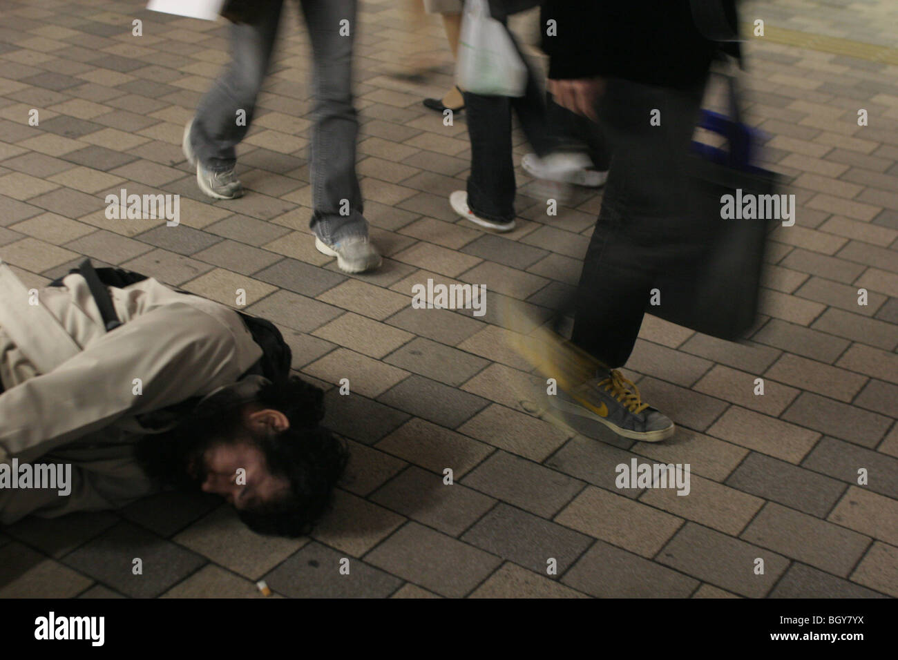 Man collapsed on street in Tokyo, Japan, on Wednesday, Nov. 22, 2006. Stock Photo