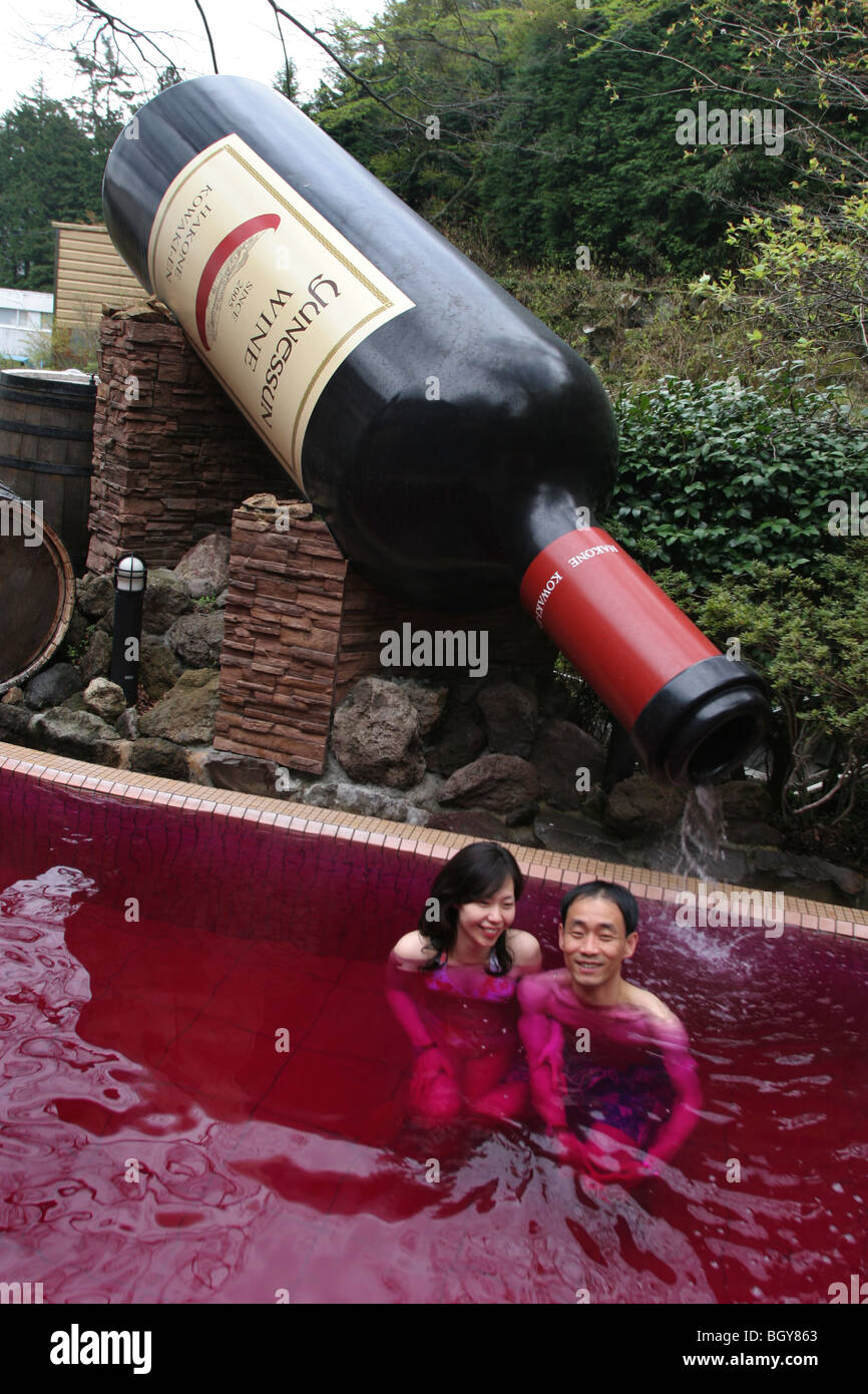 couple bathe in the "red wine" bath, ( a bath containing real red wine), at  Hakone Kowakien Yunessun in Tokyo, Japan Stock Photo - Alamy