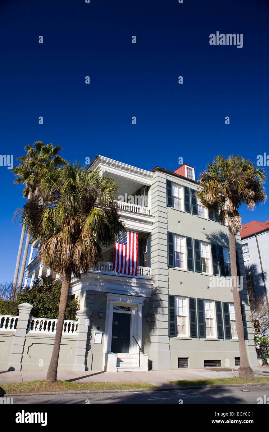 Antebellum house with American flag and Palmetto trees, East Battery, Charleston, South Carolina, United States of America. Stock Photo