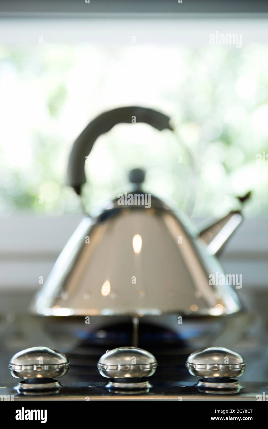 Tea kettle on gas stovetop Stock Photo Alamy