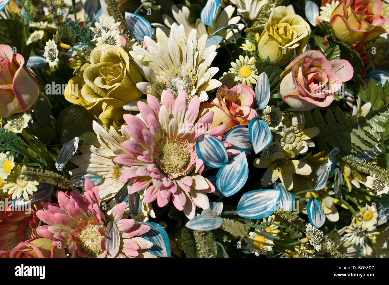 Discolored   artificial  flowers. Stock Photo