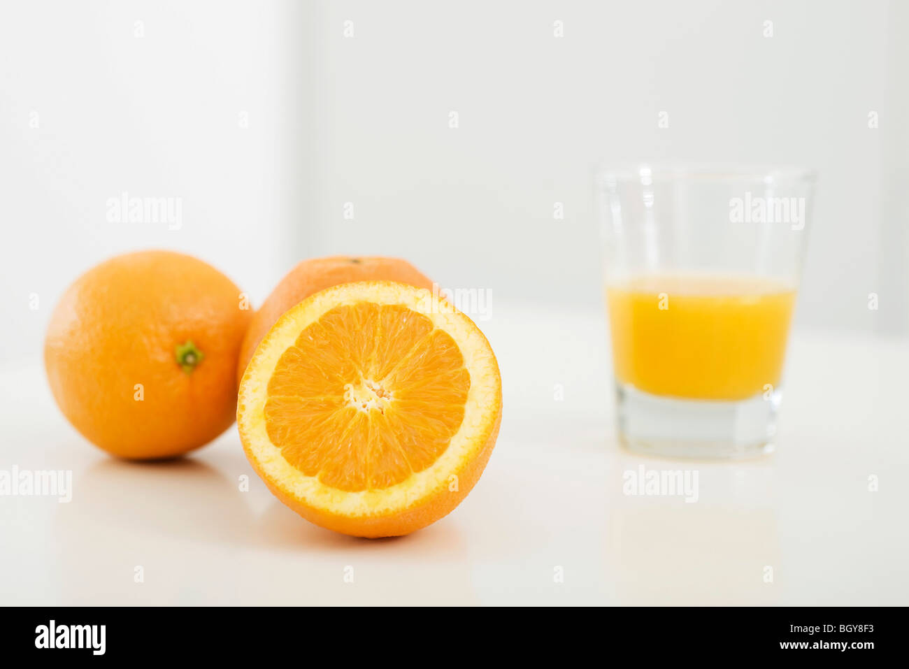 Oranges and glass of orange juice Stock Photo Alamy