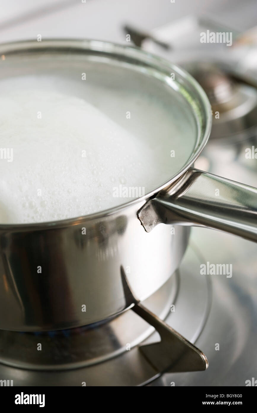 Pot cooking on stove Stock Photo