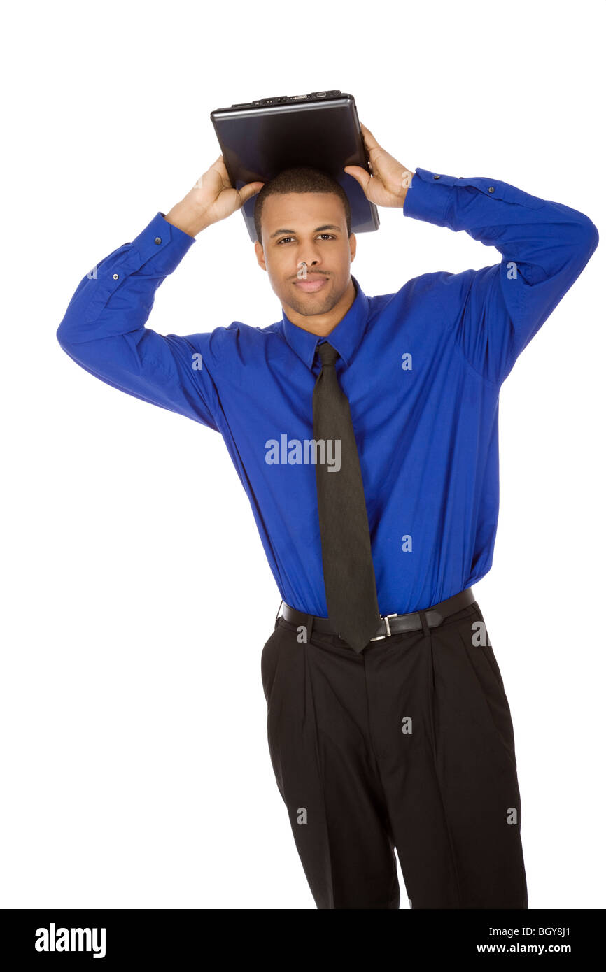 African American male businessman holding a laptop computer Stock Photo