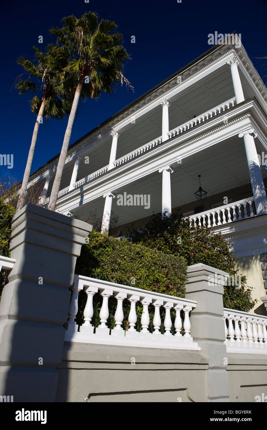 Antebellum house with multi-tiered balconies Palmetto trees, East Battery, Charleston, South Carolina, United States of America. Stock Photo