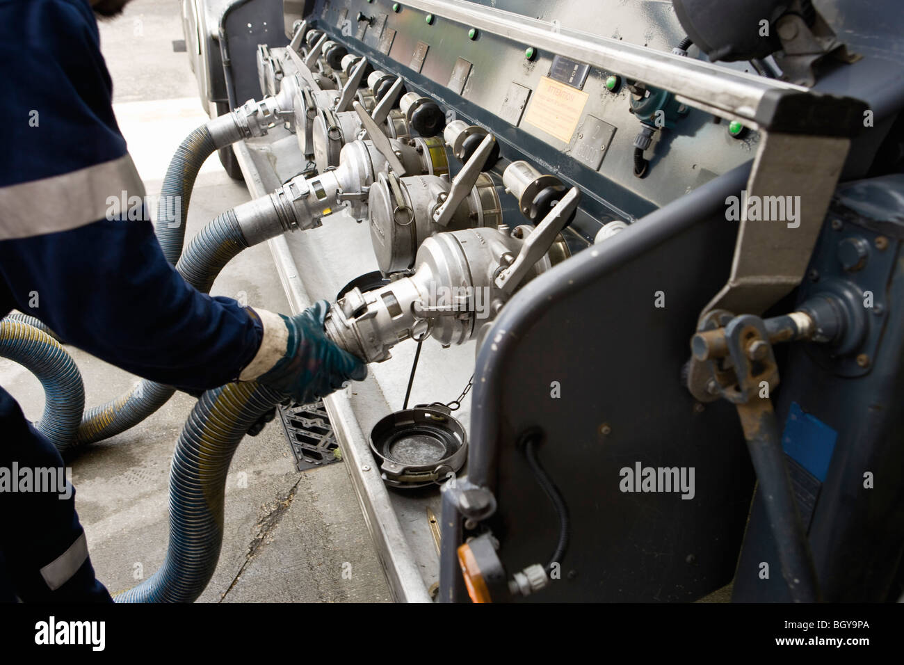 Connecting hose to fuel tanker outlet Stock Photo Alamy
