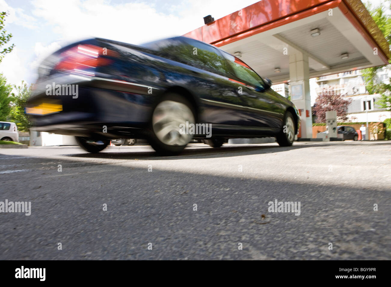 Car arriving at gas station Stock Photo