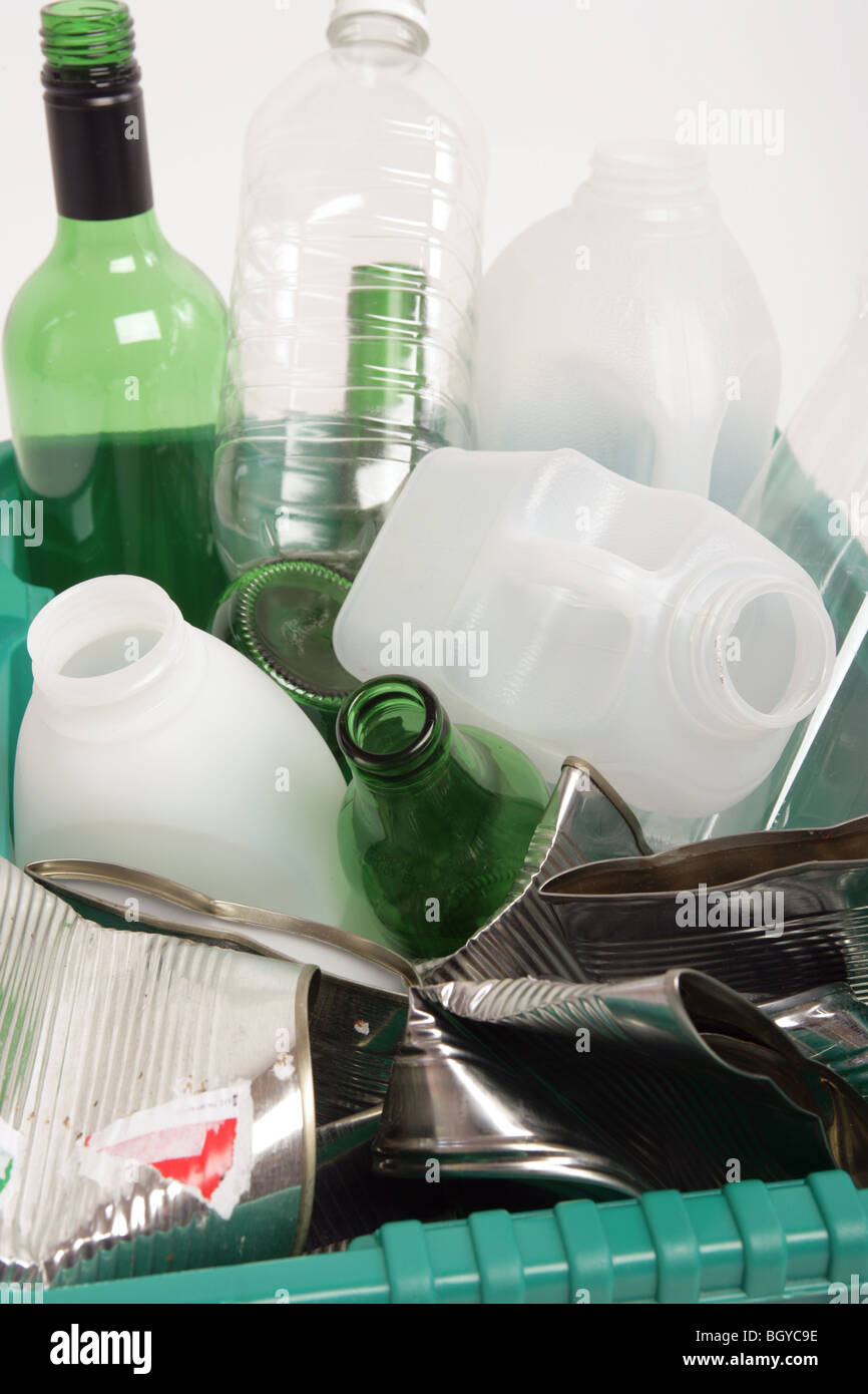 close up of plastic and glass bottles and tins in a recycling box Stock