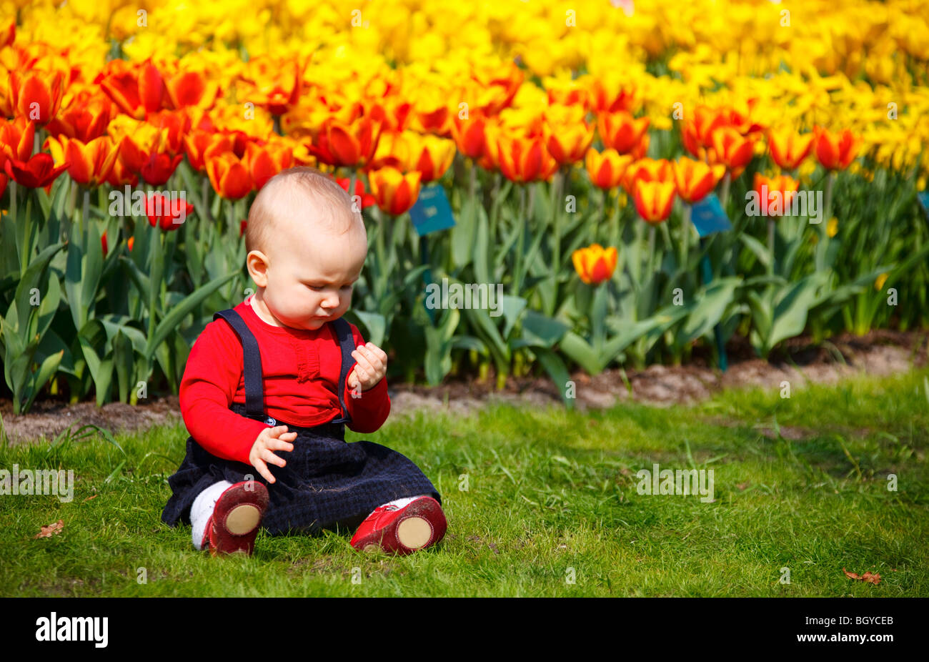 baby-girl-in-garden-stock-photo-alamy