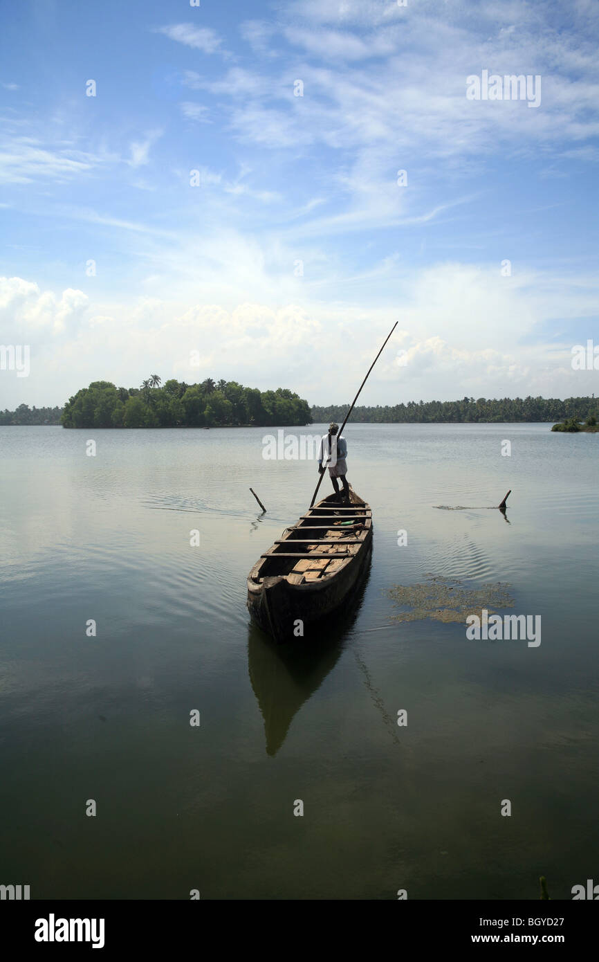 Wooden canoe taking visitors across lake to Ponnumthuruthu island, Kerala, India Stock Photo