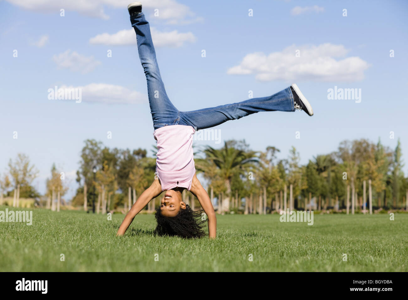 Girl doing handstand Stock Photo