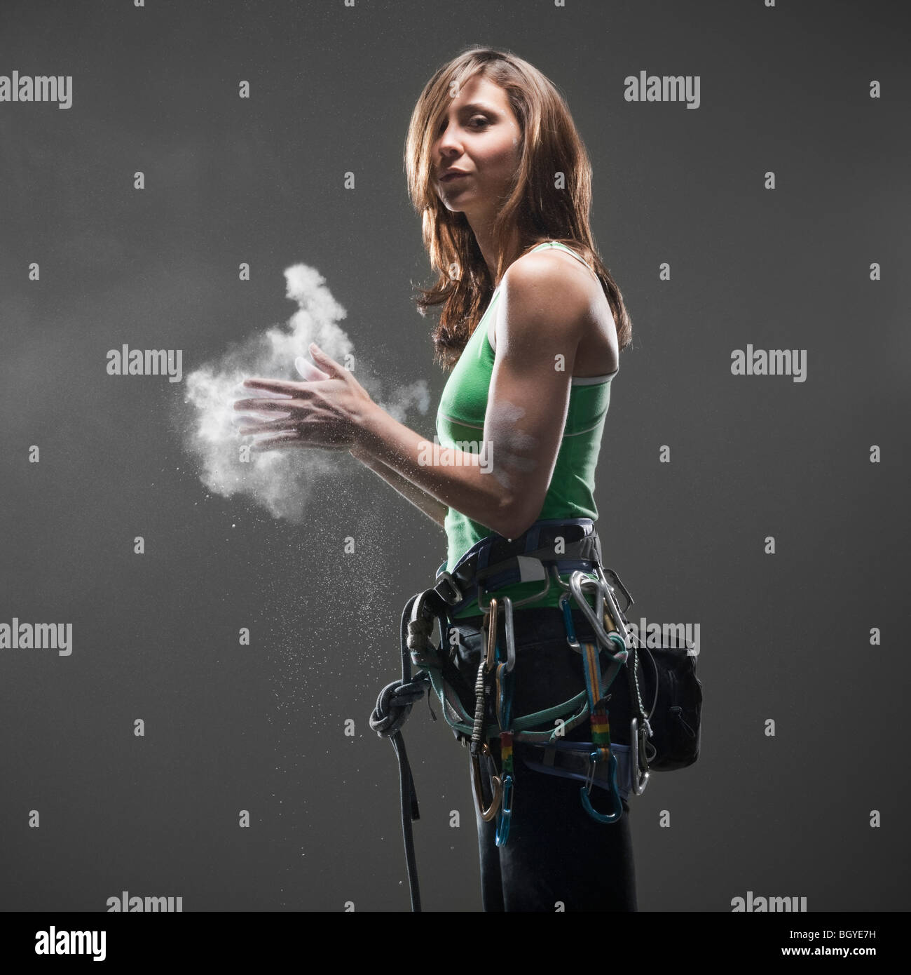 Woman climbing gear putting chalk hires stock photography and images