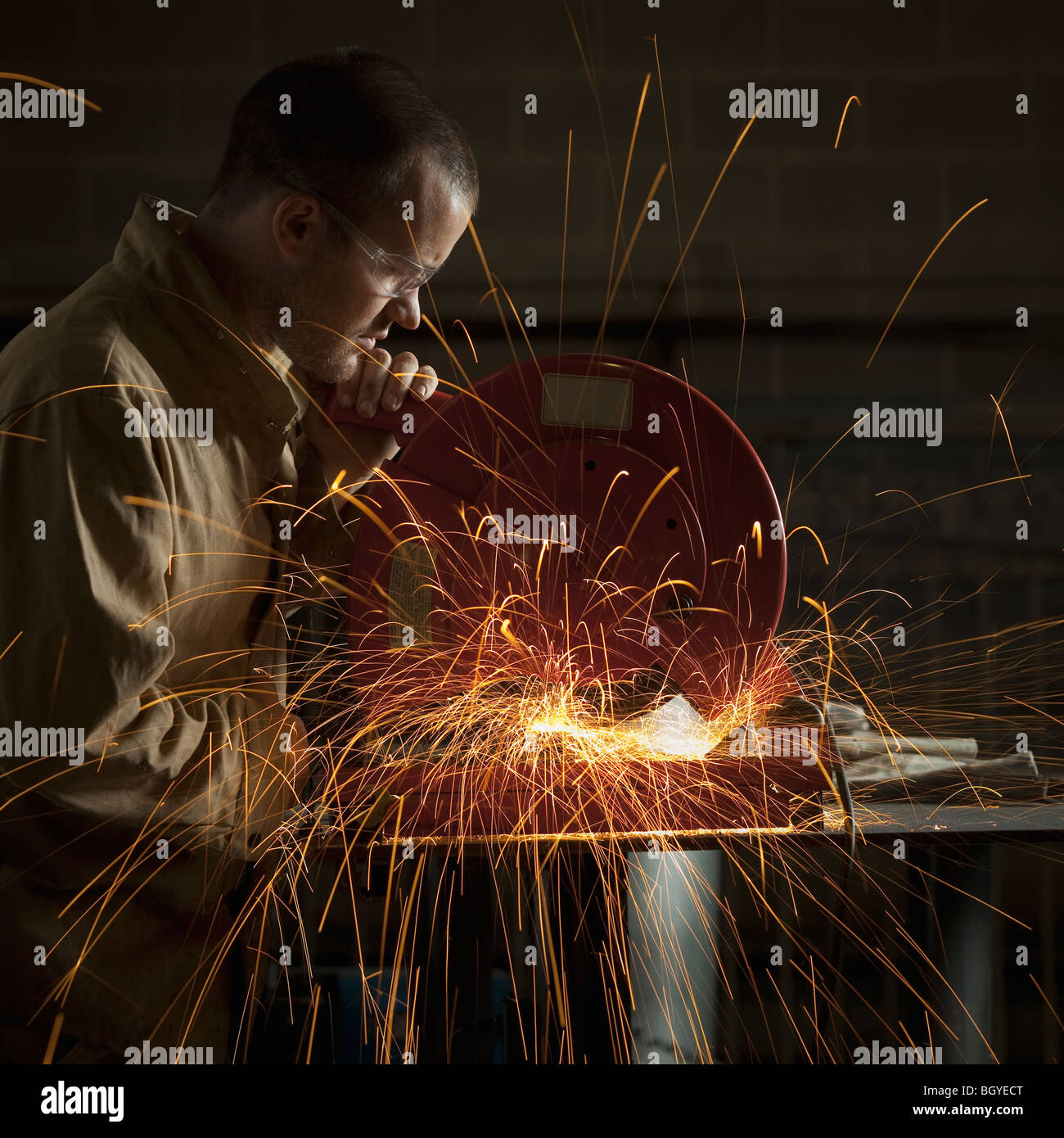 Steel grinder working in metal shop Stock Photo Alamy