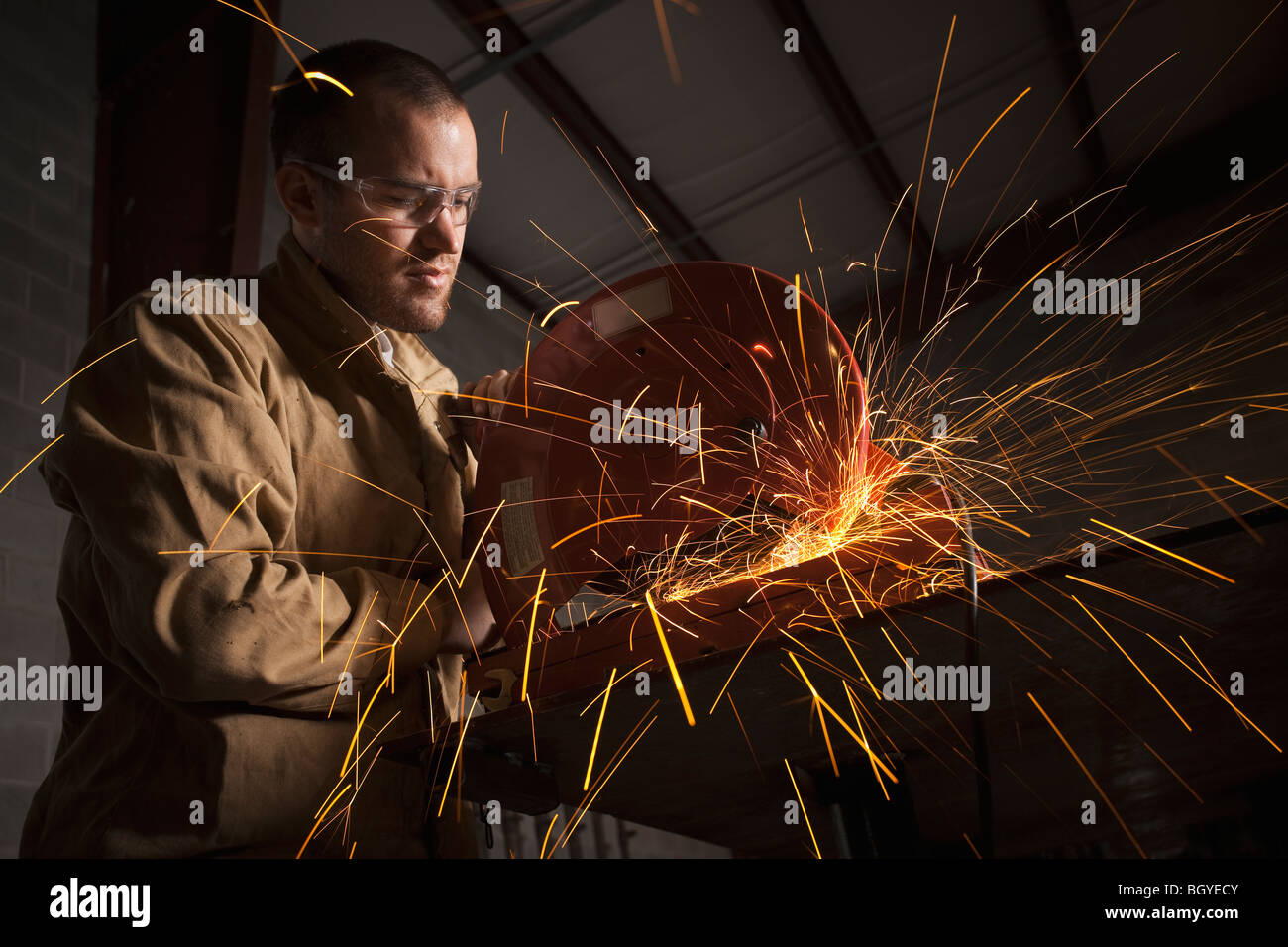 Steel grinder working in metal shop Stock Photo Alamy