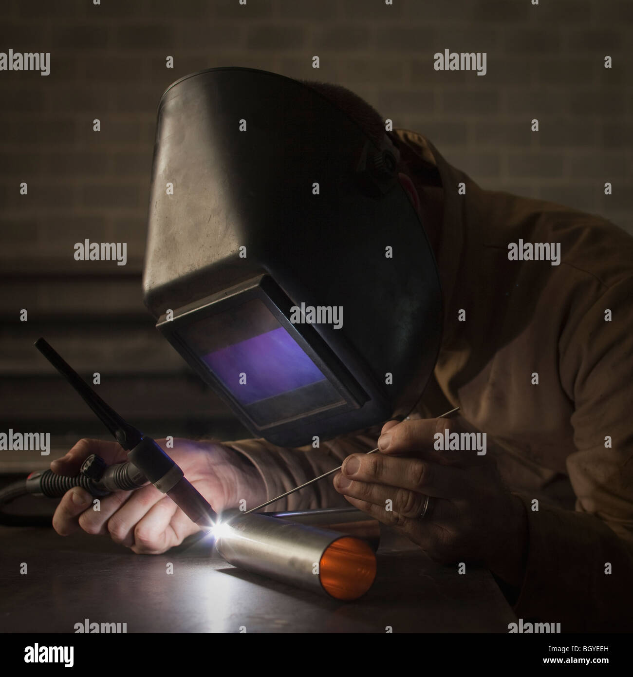 Steel worker in metal shop Stock Photo