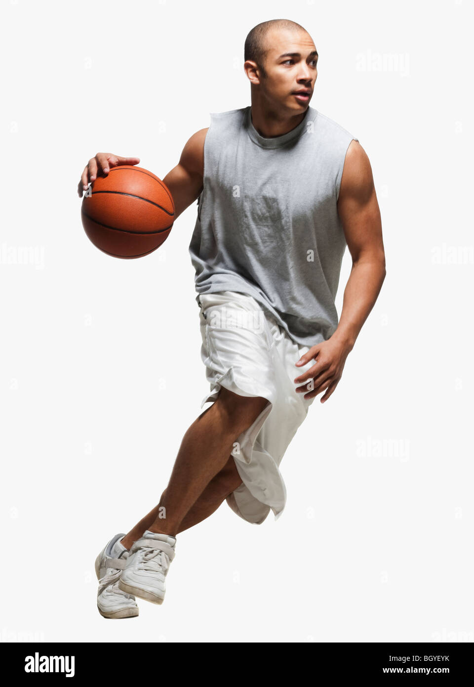 Basketball player dribbling Stock Photo