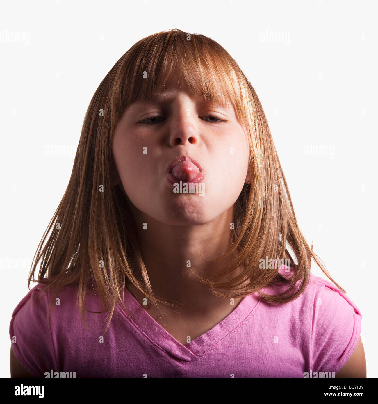 Young girl sticking tongue out Stock Photo