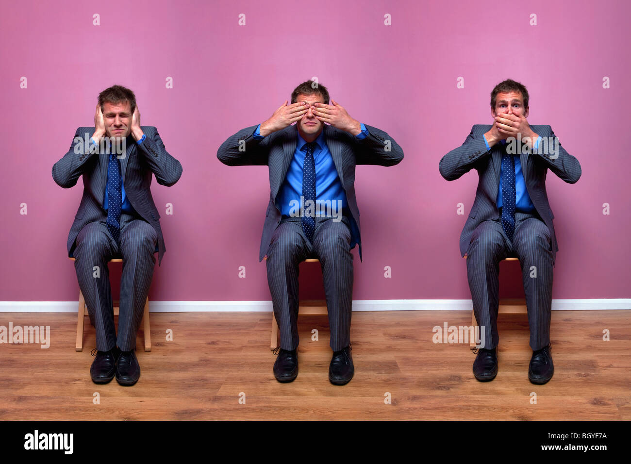 Three businessmen sitting in chairs Stock Photo - Alamy