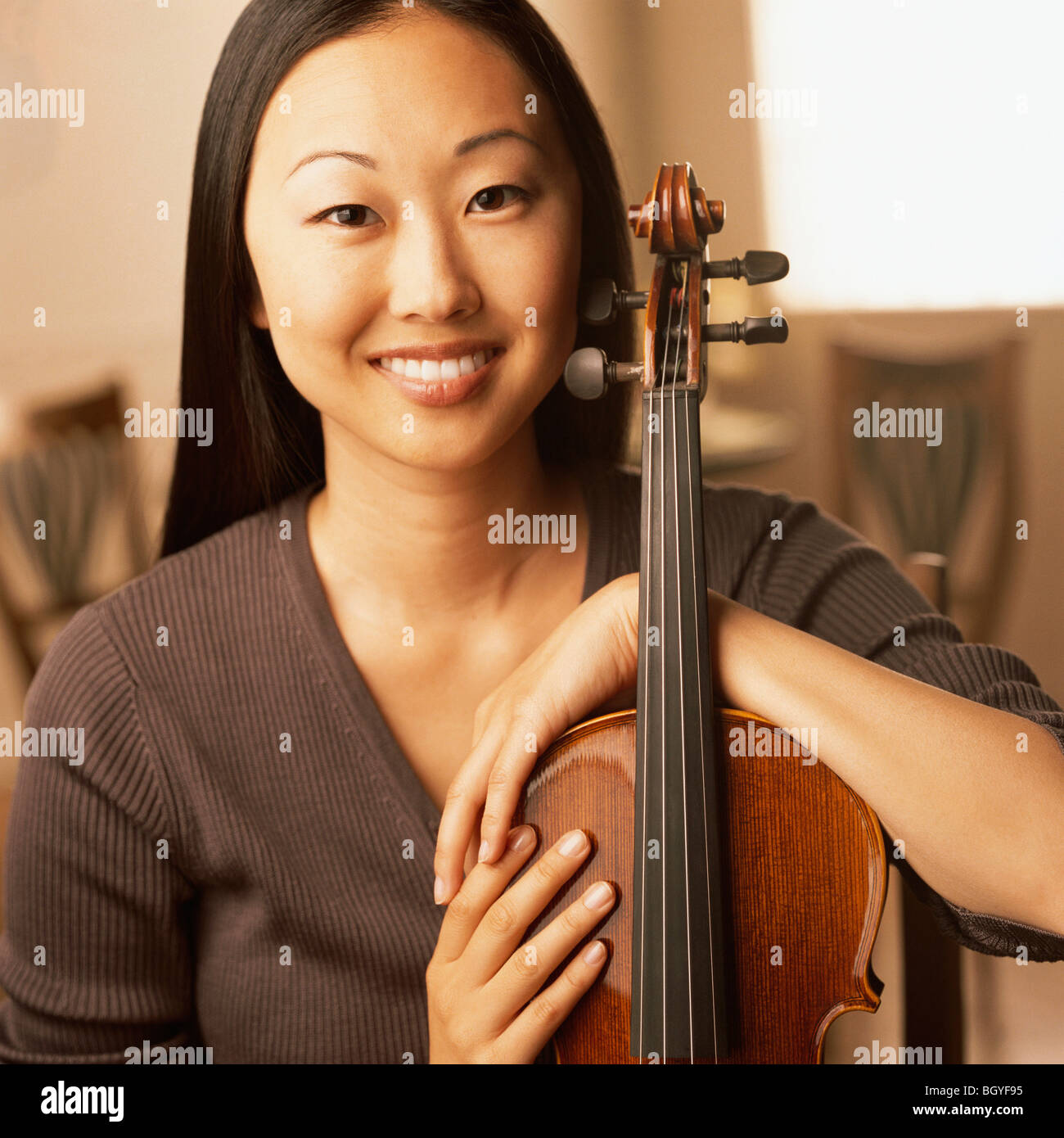 Portrait of woman with a violin Stock Photo