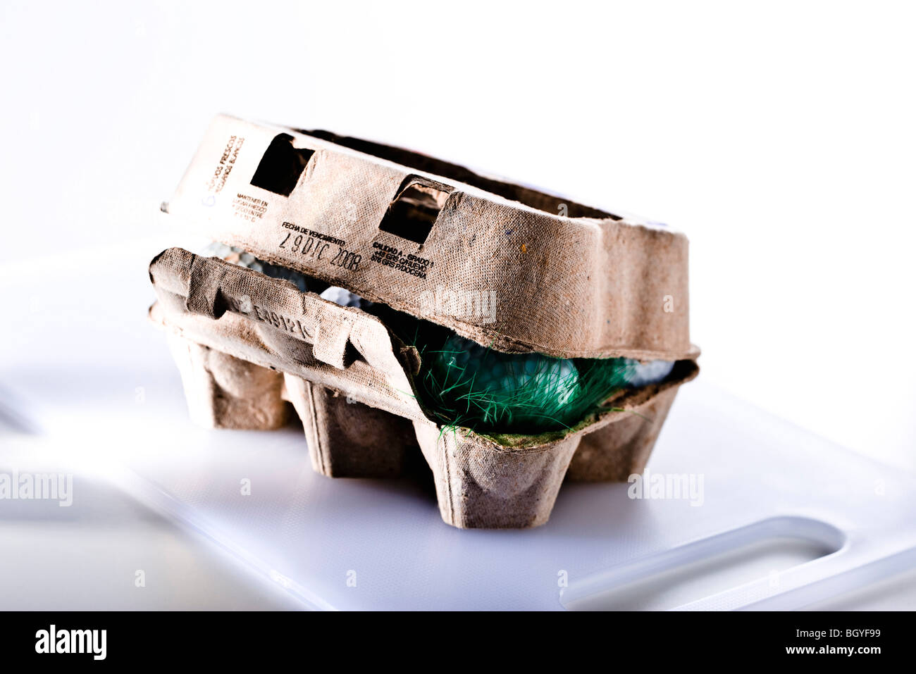 Food concept, egg carton filled with golf balls Stock Photo Alamy