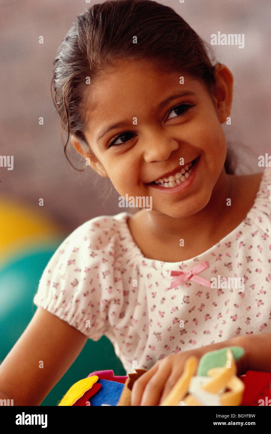 Smiling girl in classroom Stock Photo - Alamy
