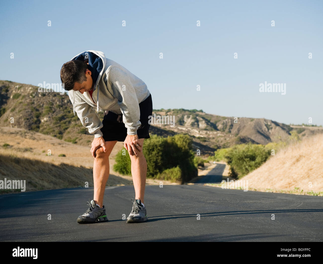 Male jogger resting Stock Photo