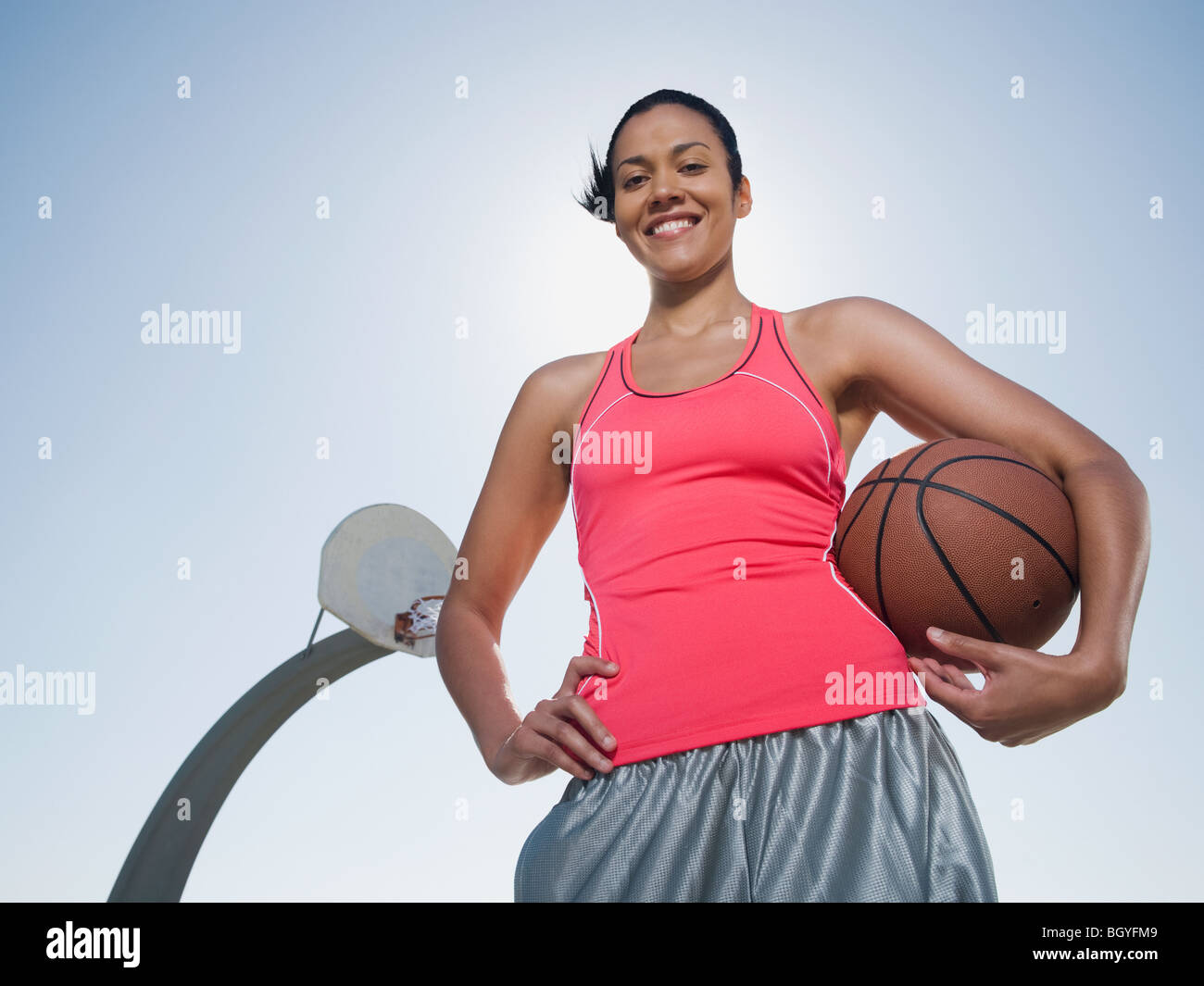 Woman holding basketball net in hi-res stock photography and images - Alamy