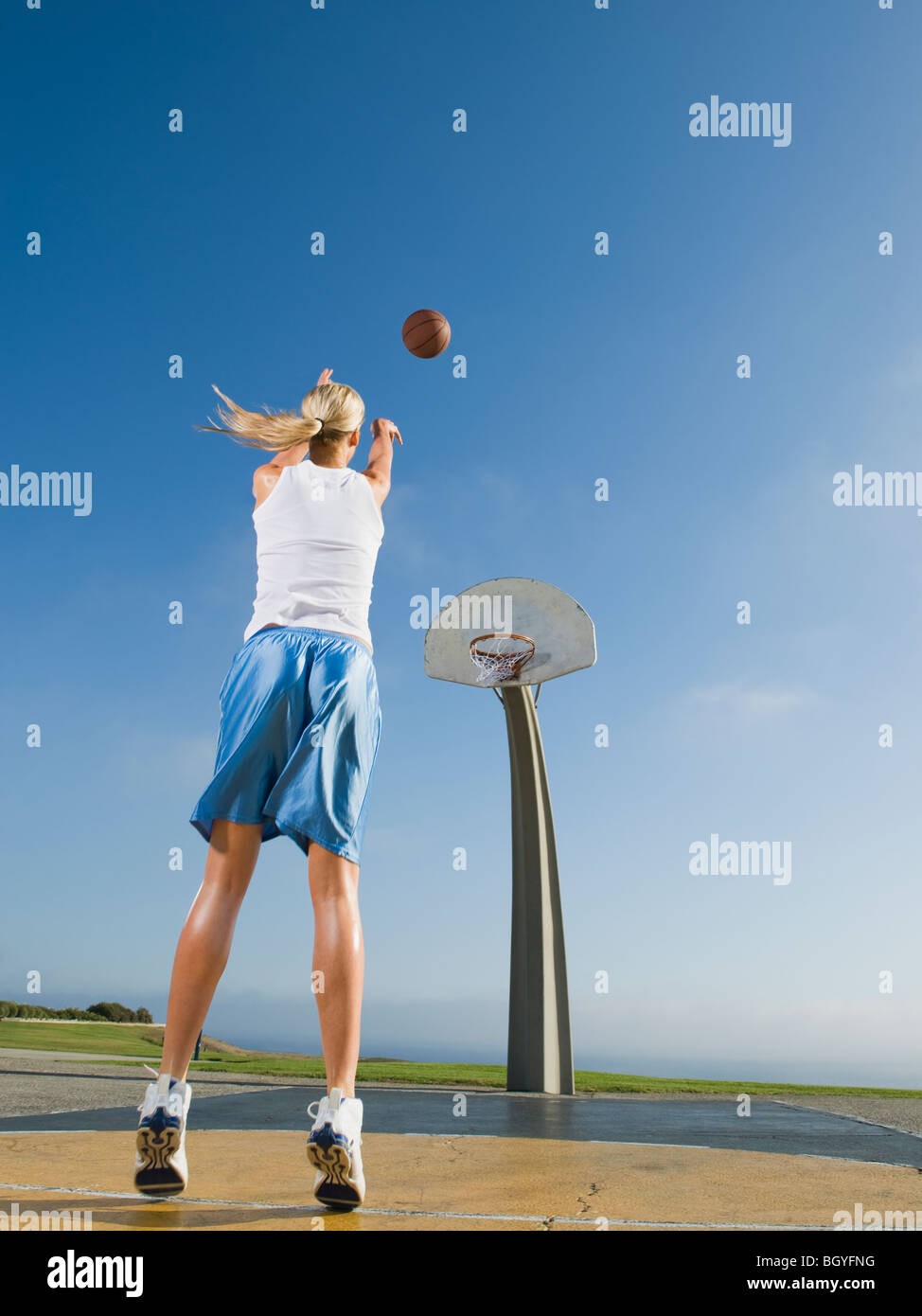 Female basketball player shooting hires stock photography and images